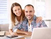 young-couple-with-computer-and-calculator