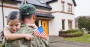 military-dad-and-daughter-in-front-of-house